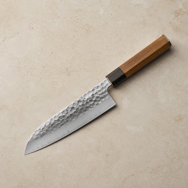 Japanese-style culinary santoku knife with a hammered blade and oak-style handle